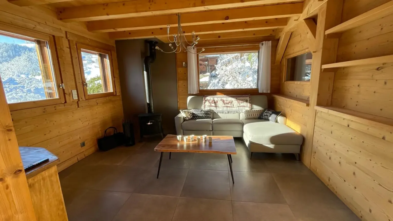 Coin détente du salon — Chalet Roc et Soleil, location saisonnière à Megève Coin détente du salon — Chalet Roc et Soleil, location saisonnière à Megève
